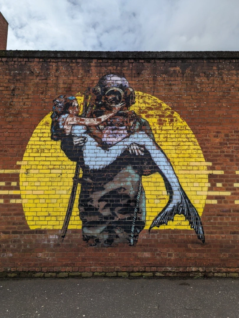 Diver holding Mermaid Graffiti